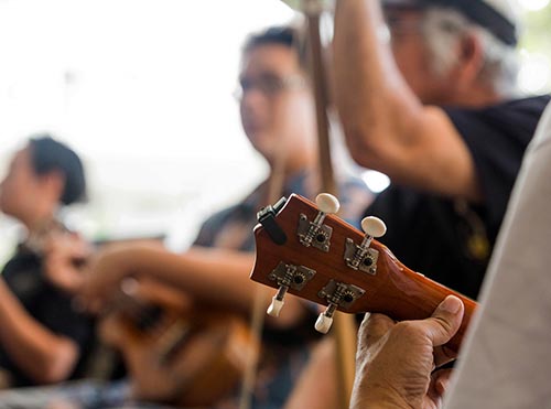 People in group therapy play music