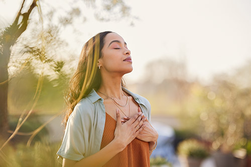 Woman meditates in nature