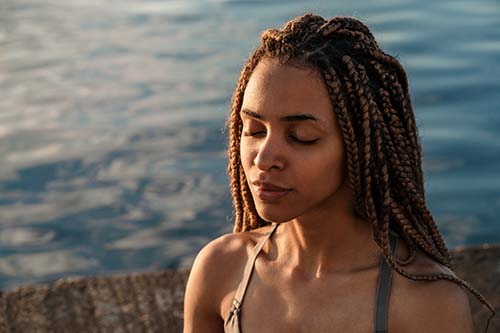 Woman smiles after taking a swim