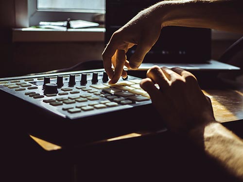 Man plays with music instrument during therapy program